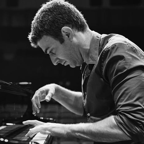 close up of man performing on piano