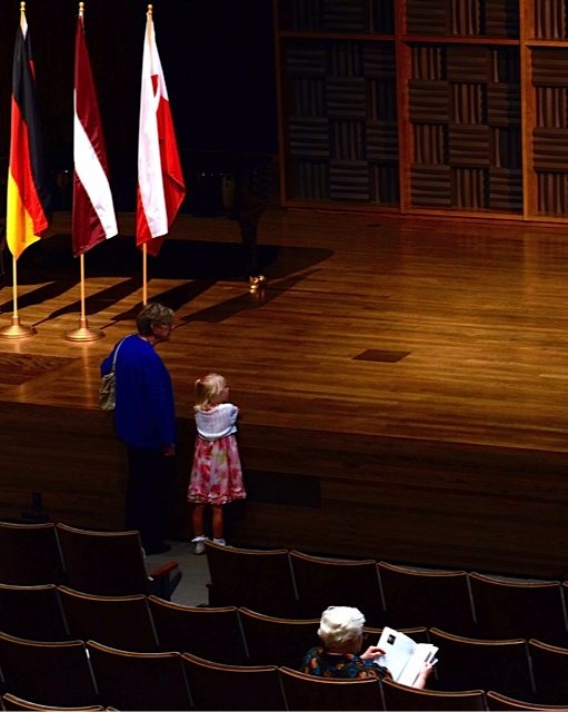 A young piano enthusiast checks out the stage at Garner Auditorium during intermission.