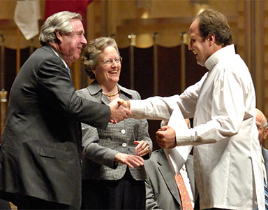 malachi mixon and wife presenting award at cleveland international piano competition