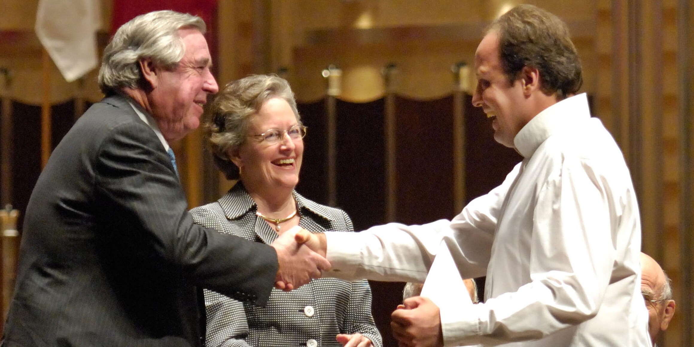 malachi mixon and wife presenting award at cleveland international piano competition