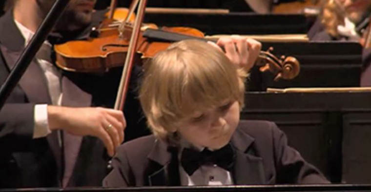 Elisey Mysin close-up playing the piano